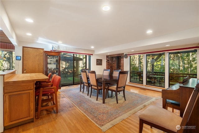 dining room featuring plenty of natural light and light wood-type flooring