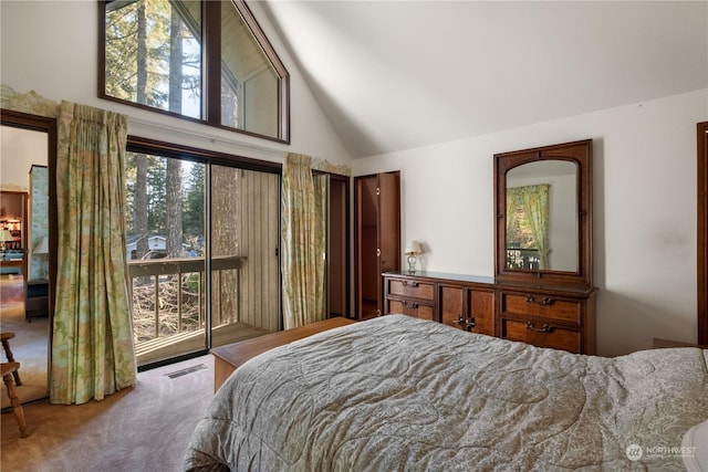 carpeted bedroom featuring high vaulted ceiling and access to outside