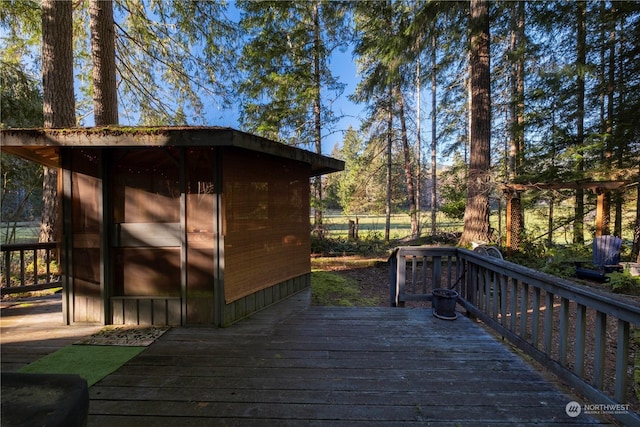 wooden terrace with a storage unit