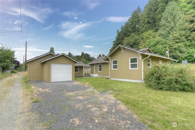 view of front of property featuring a garage and a front yard