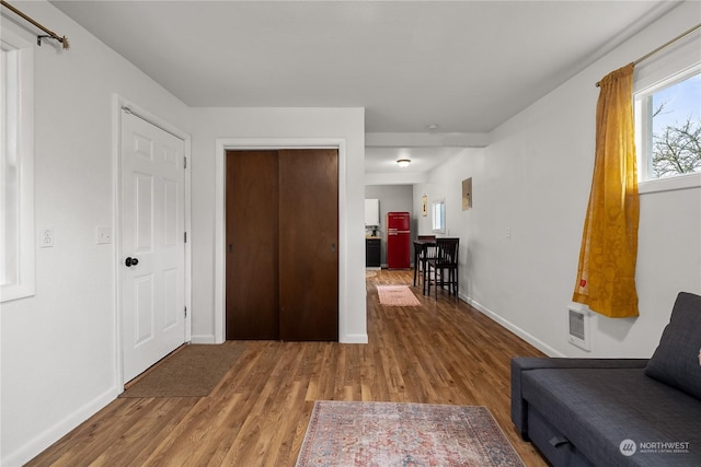 hallway featuring hardwood / wood-style flooring