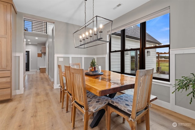 dining space with light hardwood / wood-style floors