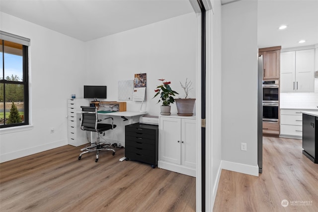 home office featuring light hardwood / wood-style floors