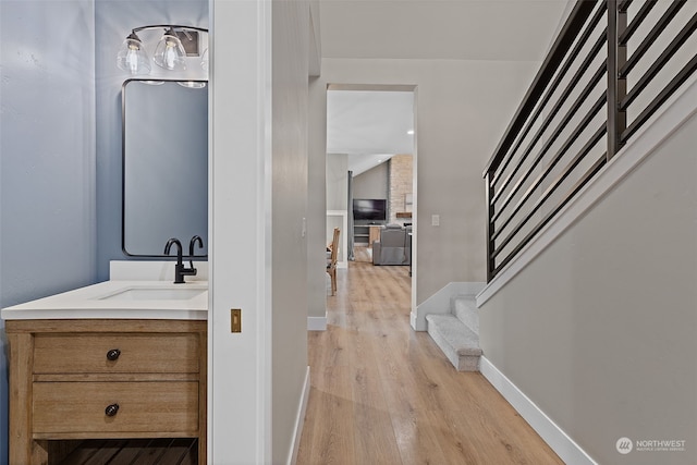 bathroom with vanity and hardwood / wood-style floors