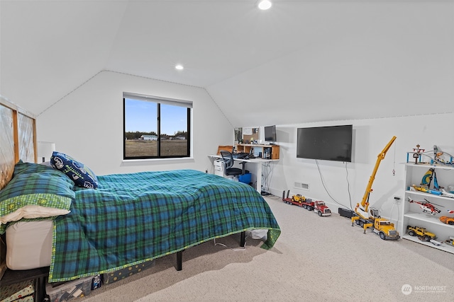 carpeted bedroom with vaulted ceiling