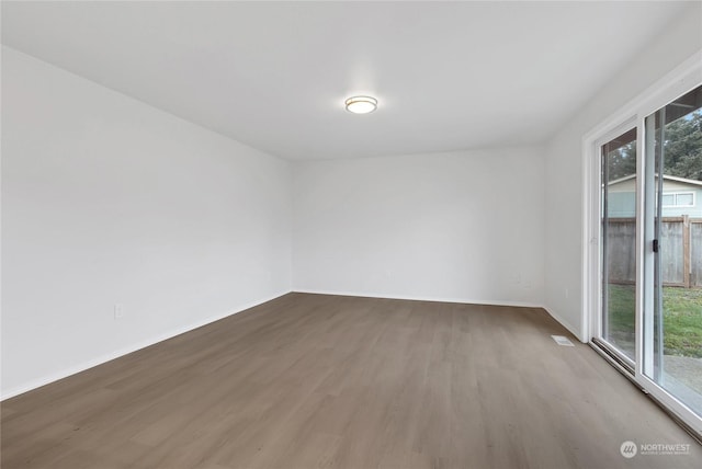 empty room featuring hardwood / wood-style floors