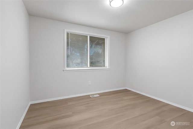 unfurnished room featuring light hardwood / wood-style floors