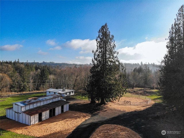 view of property's community featuring an outdoor structure