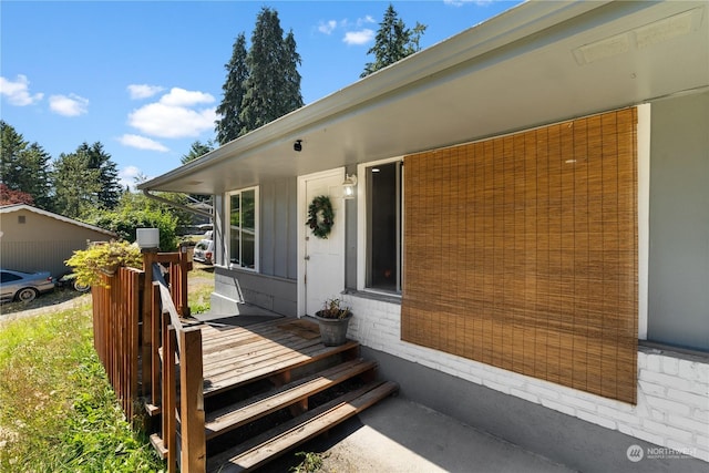 entrance to property with a wooden deck