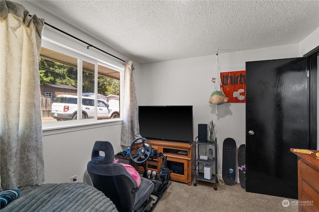 carpeted bedroom featuring a textured ceiling