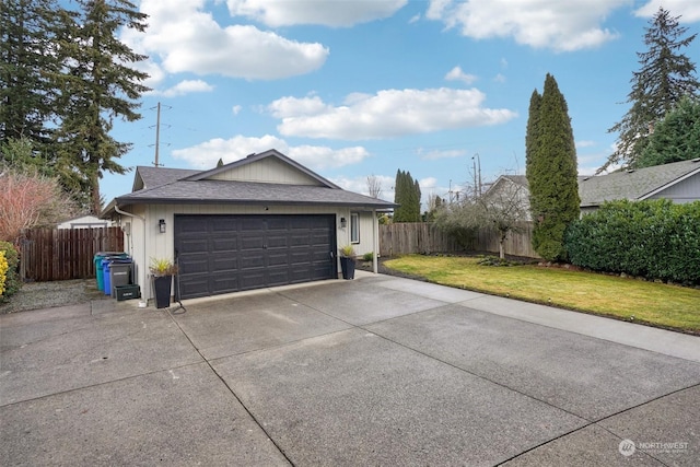 exterior space featuring a garage and a lawn