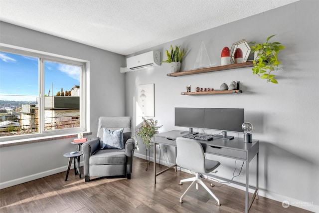 office area with wood finished floors, a textured ceiling, baseboards, and a wall mounted AC