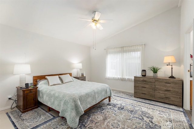 bedroom featuring vaulted ceiling, baseboards, and ceiling fan