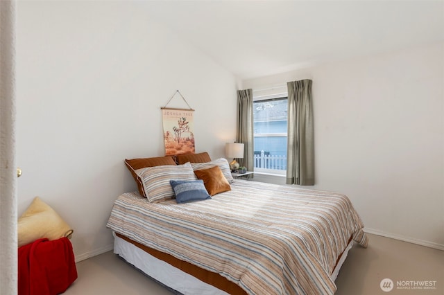 bedroom featuring carpet flooring and baseboards