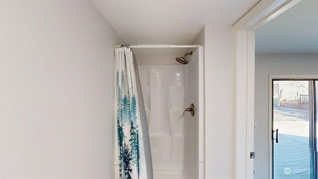 bathroom with a shower with shower curtain