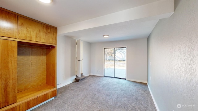 mudroom with light colored carpet