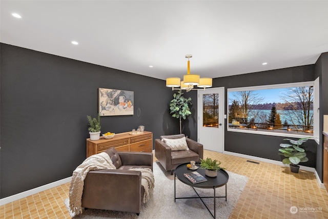 living room with an inviting chandelier