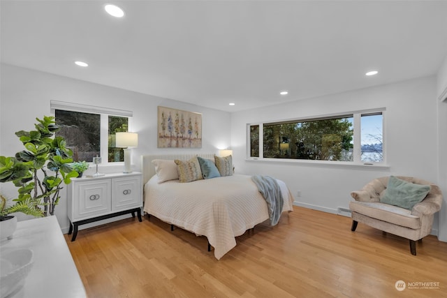 bedroom with light hardwood / wood-style flooring