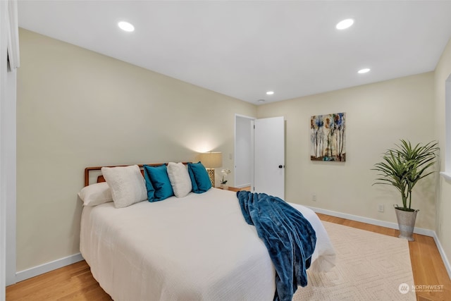 bedroom with hardwood / wood-style floors