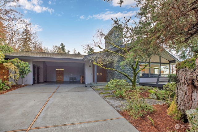 view of front of property featuring a carport