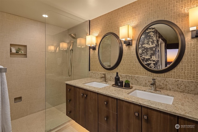 bathroom featuring vanity and a tile shower