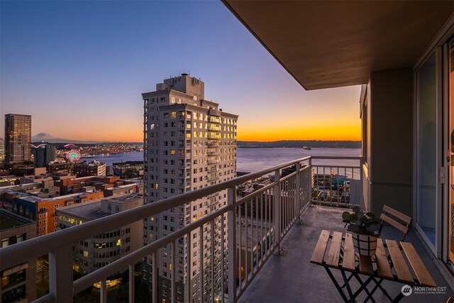 balcony at dusk with a water view