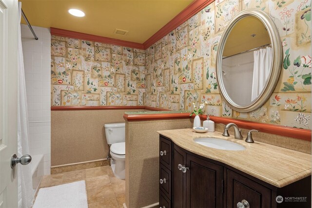 full bathroom with vanity, ornamental molding, toilet, and shower / bathtub combination with curtain