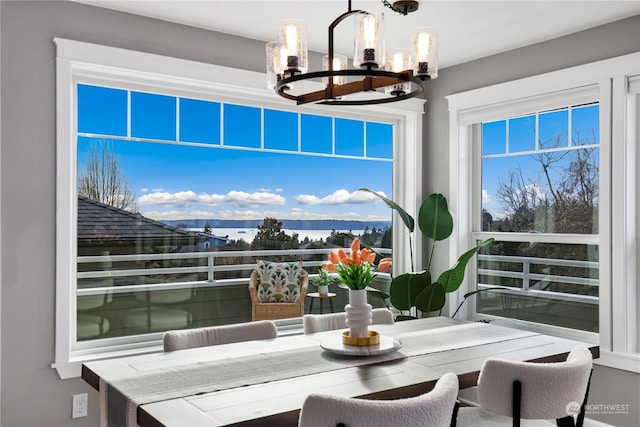 interior space featuring a mountain view and a chandelier