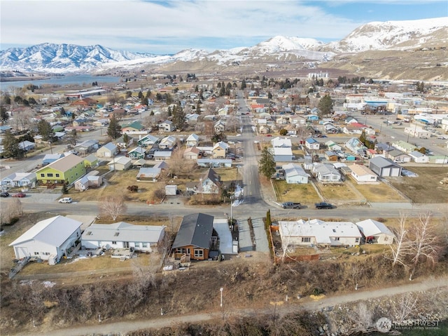 birds eye view of property featuring a mountain view