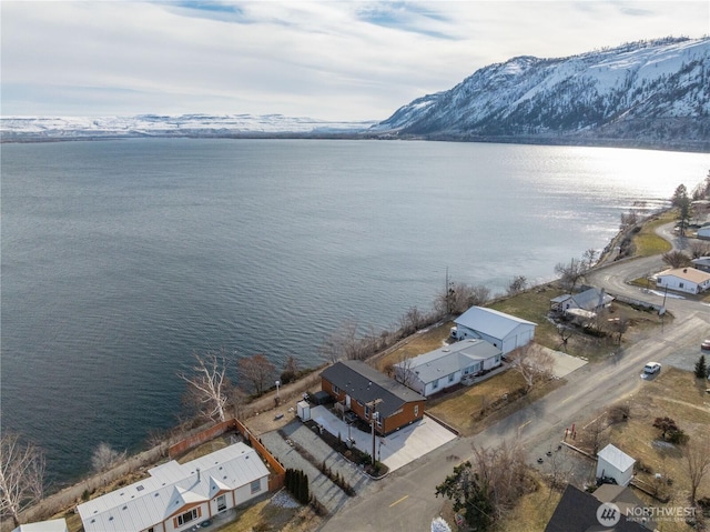 bird's eye view featuring a water and mountain view