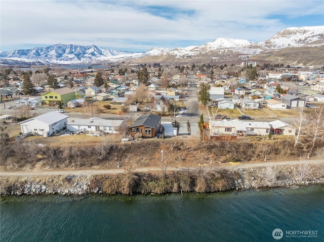 birds eye view of property featuring a water and mountain view