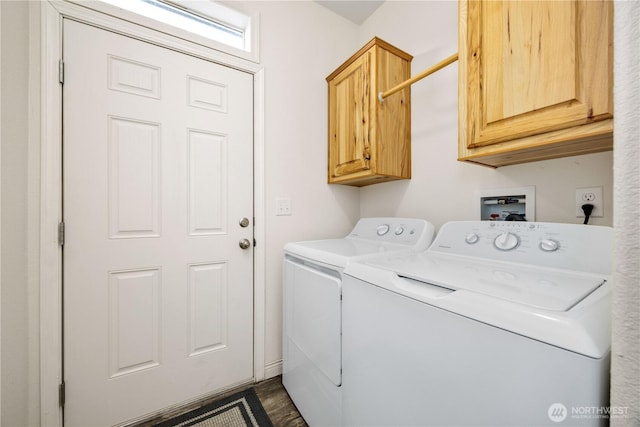 washroom featuring washer and clothes dryer and cabinets