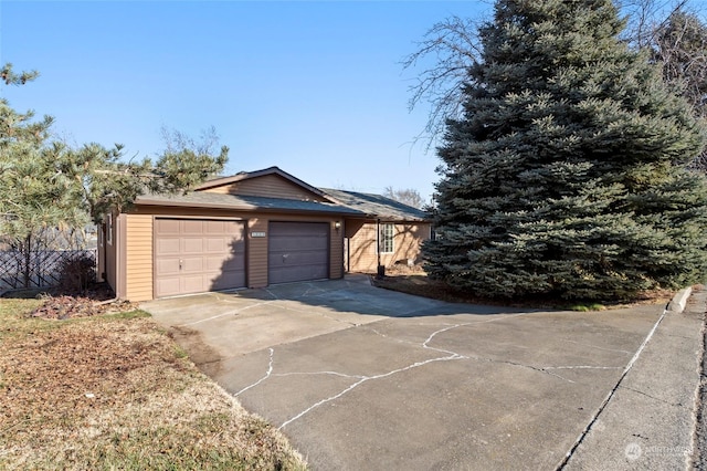 single story home featuring a garage