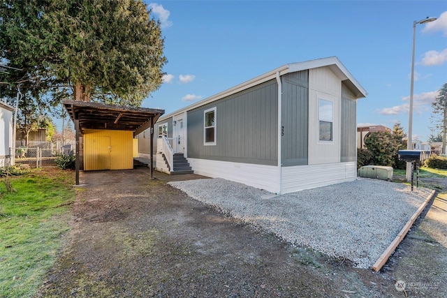 view of home's exterior with a carport