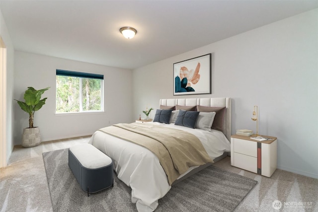bedroom featuring carpet and baseboards