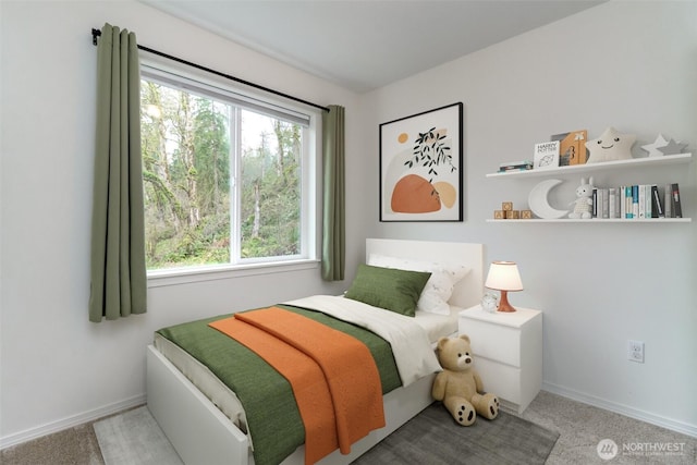 carpeted bedroom with baseboards