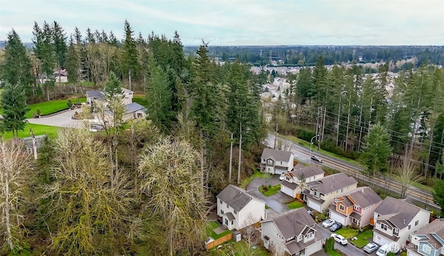 bird's eye view featuring a view of trees and a residential view