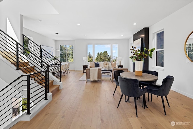 dining space with light hardwood / wood-style floors