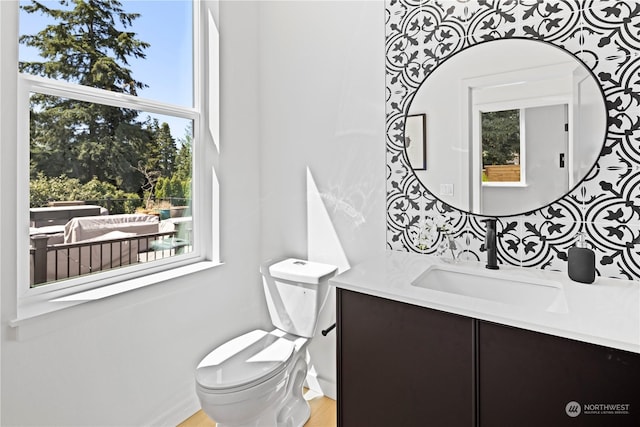 bathroom with vanity and toilet