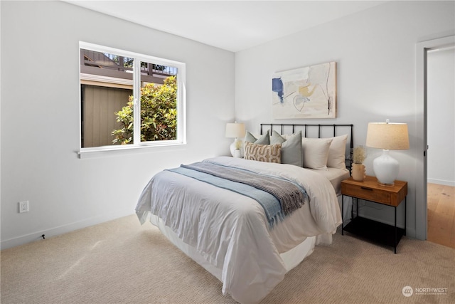 bedroom with light carpet