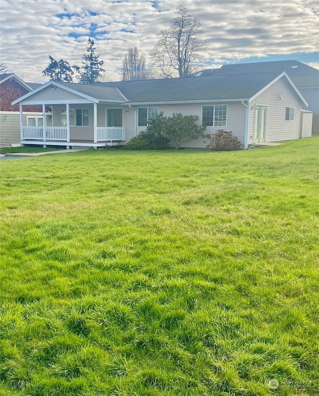 view of front of property featuring a front lawn and a porch