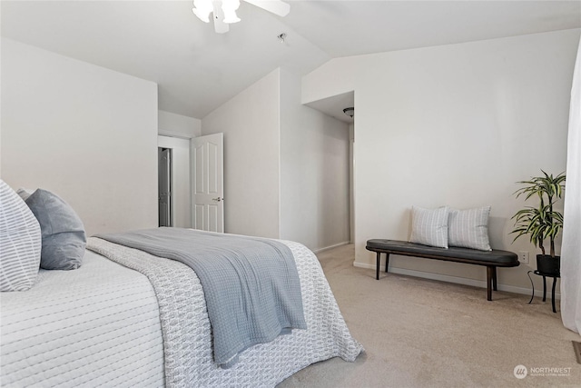 carpeted bedroom featuring lofted ceiling and ceiling fan