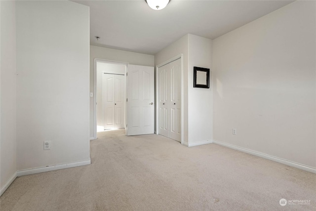 unfurnished room with light colored carpet