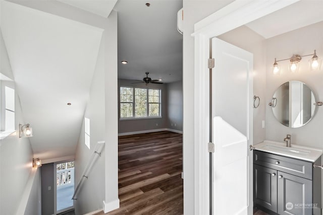 bathroom featuring vanity, hardwood / wood-style floors, and ceiling fan