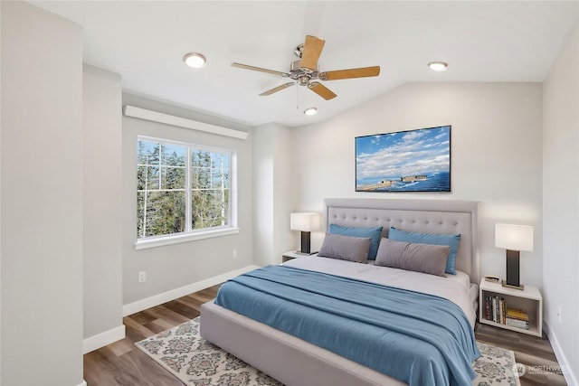 bedroom featuring vaulted ceiling, dark hardwood / wood-style floors, and ceiling fan