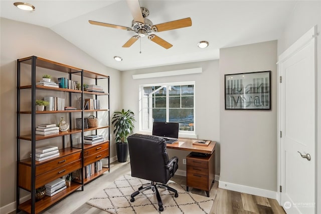 office area featuring lofted ceiling, light hardwood / wood-style floors, and ceiling fan