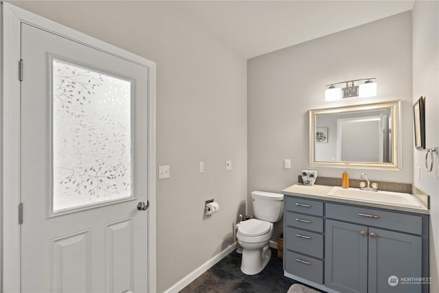 bathroom with vanity and toilet