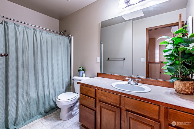 bathroom with vanity, a shower with shower curtain, and toilet