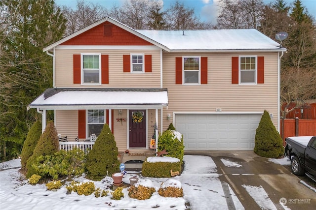 view of front of home with a porch and a garage