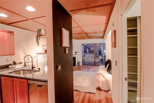 interior space with sink and light hardwood / wood-style flooring